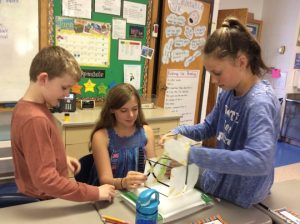 Fourth Grade engineers use shake tables to design and test earthquake-resistant building structures.