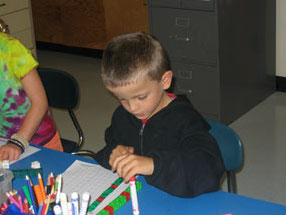 student working on math at a table